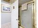 Bathroom showcasing a shower with a frosted glass door and a gold frame at 7955 Sw 62Nd Ct, Ocala, FL 34476