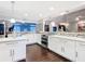 Modern kitchen featuring stainless steel appliances, ample counter space, and stylish backsplash at 7955 Sw 62Nd Ct, Ocala, FL 34476