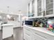 Bright kitchen featuring white cabinetry, quartz countertop, tile backsplash, and stainless appliances at 7955 Sw 62Nd Ct, Ocala, FL 34476