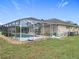 Screened-in pool and patio area perfect for outdoor relaxation and enjoyment of the backyard space at 7955 Sw 62Nd Ct, Ocala, FL 34476