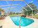 A stunning in-ground pool with screened enclosure and beautiful backyard views at 7955 Sw 62Nd Ct, Ocala, FL 34476