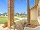 Charming front porch with stone pillars and lush landscaping adding to the curb appeal of the home at 7955 Sw 62Nd Ct, Ocala, FL 34476