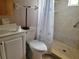 Modern bathroom with a sleek vanity, toilet, and a walk-in shower with a glass door, designed for convenience and style at 8344 Sw 107Th Pl, Ocala, FL 34481