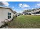 Exterior view showcasing well-kept lawn and the rear of neighboring homes at 8533 Sw 93Rd Pl # C, Ocala, FL 34481