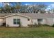 Exterior view of the home highlighting the backyard and surrounding landscape at 8533 Sw 93Rd Pl # C, Ocala, FL 34481