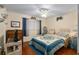 Cozy bedroom with laminate floors, window and ceiling fan at 8533 Sw 93Rd Pl # C, Ocala, FL 34481