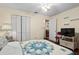 Bedroom with hardwood floors, closet, and a ceiling fan at 8533 Sw 93Rd Pl # C, Ocala, FL 34481