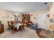 Dining room featuring a wooden table, chairs, chandelier, and china cabinet at 8533 Sw 93Rd Pl # C, Ocala, FL 34481