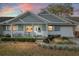Charming home featuring a welcoming porch and a well-maintained front yard with fresh landscaping at 8533 Sw 93Rd Pl # C, Ocala, FL 34481