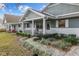 Inviting home with a charming front porch, walkway, and beautifully landscaped garden at 8533 Sw 93Rd Pl # C, Ocala, FL 34481
