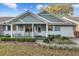 Charming home featuring a welcoming porch and a well-maintained front yard with fresh landscaping at 8533 Sw 93Rd Pl # C, Ocala, FL 34481