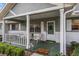 Cozy front porch featuring seating, decorative plants, and a welcoming entrance at 8533 Sw 93Rd Pl # C, Ocala, FL 34481