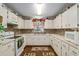 Kitchen featuring white appliances and cabinets at 8533 Sw 93Rd Pl # C, Ocala, FL 34481