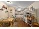 Eat-in kitchen featuring white cabinets and laminate flooring at 8533 Sw 93Rd Pl # C, Ocala, FL 34481