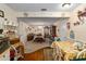 Open concept living room with a view into the dining room and kitchen at 8533 Sw 93Rd Pl # C, Ocala, FL 34481