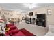 Open-concept living area with a bar, fireplace, and comfortable seating at 8533 Sw 93Rd Pl # C, Ocala, FL 34481