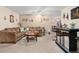 A spacious living room includes a sectional sofa and a bar area at 8533 Sw 93Rd Pl # C, Ocala, FL 34481