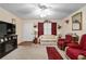 Cozy living room with carpet flooring, fireplace, and comfortable seating at 8533 Sw 93Rd Pl # C, Ocala, FL 34481