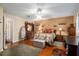 Spacious main bedroom featuring wood floors and a large dresser at 8533 Sw 93Rd Pl # C, Ocala, FL 34481