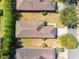 Aerial view shows a well-maintained home with a brown roof, surrounded by green lawns and mature trees at 9346 Sw 73Rd St, Ocala, FL 34481