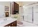 Bathroom featuring a shower-tub combo, vanity, and storage cabinet at 9346 Sw 73Rd St, Ocala, FL 34481