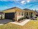 Charming single-story home features a well-maintained lawn, a two-car garage and manicured landscaping at 9346 Sw 73Rd St, Ocala, FL 34481