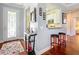 Inviting foyer featuring hardwood floors, natural light, and an open view to the kitchen at 9346 Sw 73Rd St, Ocala, FL 34481