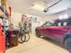 Organized garage with shelving, a parked SUV, and space for bikes and storage at 9346 Sw 73Rd St, Ocala, FL 34481