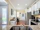 Bright kitchen featuring stainless steel appliances, white cabinets and wood flooring at 9346 Sw 73Rd St, Ocala, FL 34481