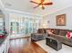 Comfortable living room with hardwood floors, neutral colors, stylish decor, and a view of the patio at 9346 Sw 73Rd St, Ocala, FL 34481