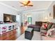 Spacious living room with hardwood floors, neutral colors, and an open layout with abundant natural light at 9346 Sw 73Rd St, Ocala, FL 34481