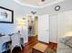 Comfortable home office with desk space, stylish decor, and hardwood floors at 9346 Sw 73Rd St, Ocala, FL 34481
