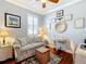 A cozy office space with wicker furniture, natural lighting, and wall decor at 9346 Sw 73Rd St, Ocala, FL 34481