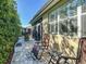 Inviting patio area with lounge chairs, perfect for relaxing and enjoying the outdoor space near manicured hedges at 9346 Sw 73Rd St, Ocala, FL 34481