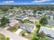 Aerial view of single-Gathering home, landscaped yard, and view of the surrounding community at 9886 Se 178Th Ln, Summerfield, FL 34491