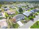 Overhead view of the house, long driveway, and surrounding neighborhood at 9886 Se 178Th Ln, Summerfield, FL 34491