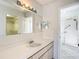 Bathroom with a sink, toilet, shower, and linen closet at 9886 Se 178Th Ln, Summerfield, FL 34491