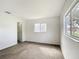Bedroom features neutral carpet and two windows for plenty of natural light at 9886 Se 178Th Ln, Summerfield, FL 34491