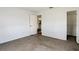 Bedroom with neutral carpet and white door to the closet at 9886 Se 178Th Ln, Summerfield, FL 34491