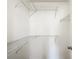 Walk-in closet with white walls and wire shelving providing ample storage space at 9886 Se 178Th Ln, Summerfield, FL 34491