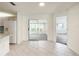 Bright dining area featuring tile floors and a view of the sliding doors at 9886 Se 178Th Ln, Summerfield, FL 34491