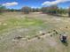 Aerial shot of a driving range, featuring players, golf carts, and well-maintained turf at 9886 Se 178Th Ln, Summerfield, FL 34491