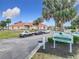 An exterior view of The Links Club clubhouse, sign, and surrounding landscaping and parking at 9886 Se 178Th Ln, Summerfield, FL 34491