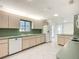 Efficient kitchen showcasing generous countertops, a clean backsplash, and essential appliances at 9886 Se 178Th Ln, Summerfield, FL 34491