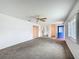 Spacious living room with new carpeting, bright lighting, and open floor plan at 9886 Se 178Th Ln, Summerfield, FL 34491