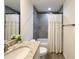 Bathroom showcasing granite countertop vanity, gray-tiled shower, and modern fixtures at 1370 Sw Obee Ridge Rd, Dunnellon, FL 34432