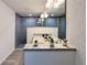 Bright bathroom boasts a granite double vanity, contemporary lighting, and a tiled glass shower at 1370 Sw Obee Ridge Rd, Dunnellon, FL 34432