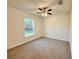 Bedroom featuring a window and ceiling fan at 1370 Sw Obee Ridge Rd, Dunnellon, FL 34432