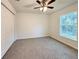 Bedroom featuring a window and ceiling fan at 1370 Sw Obee Ridge Rd, Dunnellon, FL 34432