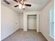 Bedroom featuring a window, closet, and ceiling fan at 1370 Sw Obee Ridge Rd, Dunnellon, FL 34432